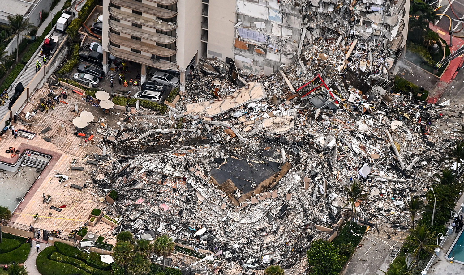 Aerial view of emergency workers and crews search Surfside Condo collapse rubble for survivors