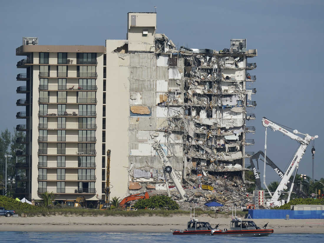 Side view of the Surfide building collaapse with Miami Dade Fire & Rescue boats in the foreground.