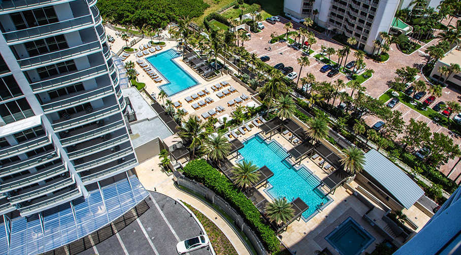 Front view, aerial drone photo of Sheridan by the Beach residential condos in Hollywood, FL