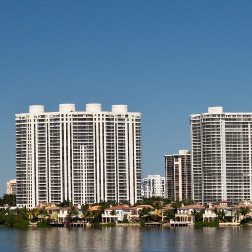 milestone-inspection-what-is-v2 High-rise condominium buildings on the waterfront in Florida requiring milestone inspection services.