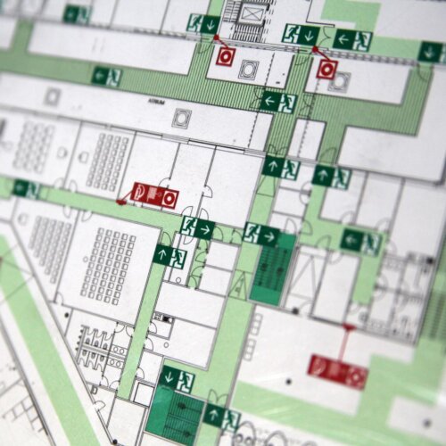 Condo building evacuation plan showing emergency exits and designated escape routes.