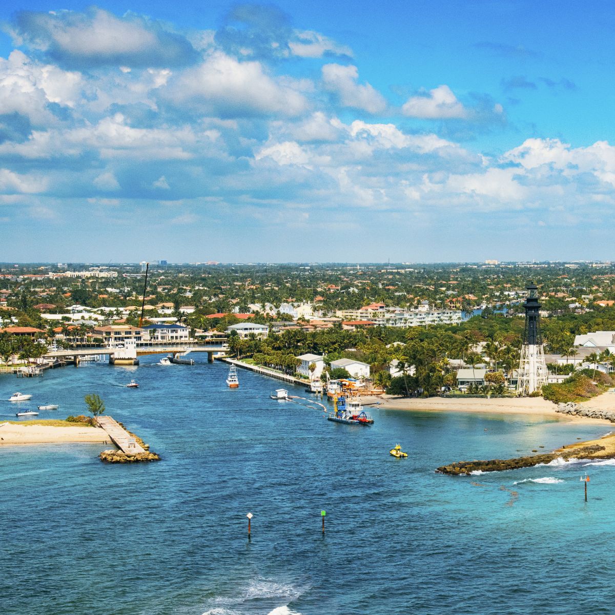 Aerial view of the beach with boats in Pompano Beach, FL.